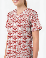 Jesus Loves You Heart Bow Nursing Scrub Top - Scrubloop