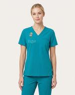 Personalized Birth Month Flower Nurse God Is Within Her She Will Not Fall Top - Scrubloop