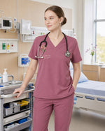 Personalized Birth Month Flower Nurse God Is Within Her She Will Not Fall Top - Scrubloop