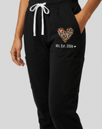 Personalized Job Title And Year Nurse Heart Leopard Pattern Women's One-Pocket V-neck Scrub Set - Scrubloop