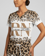 Personalized Job Title And Year Nurse Leopard Pattern Women's One-Pocket V-neck Scrub Set - Scrubloop