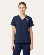 Personalized Name And Birth Month Flower Now In God's Hand Still In My Heart Memorial Hidden Message Gift For Nurse Top - Scrubloop
