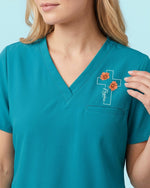 Personalized Name And Birth Month Flower Now In God's Hand Still In My Heart Memorial Hidden Message Gift For Nurse Top - Scrubloop