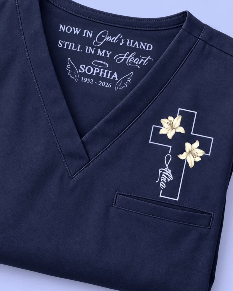 Personalized Name And Birth Month Flower Now In God's Hand Still In My Heart Memorial Hidden Message Gift For Nurse Top - Scrubloop