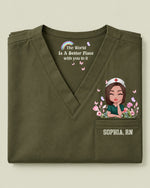 Personalized Name And Specialty The World Is A Better Place With You In It Hidden Message Rainbow Flower Decor Gift For Nurse Top - Scrubloop