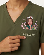 Personalized Name And Specialty The World Is A Better Place With You In It Hidden Message Rainbow Flower Decor Gift For Nurse Top - Scrubloop