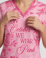 Personalized Name In October We Wear Pink Breast Cancer Awareness Flower Bow Pattern Gift For Nurse Top - Scrubloop