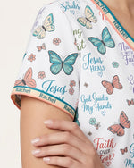 Personalized Name Jesus Quote Butterfly Pattern Christian Gift For Nurse Top - Scrubloop